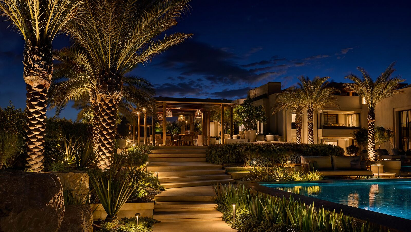 Villa garden lit at night